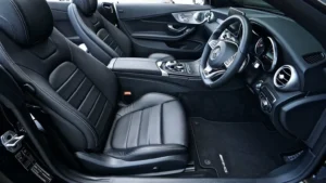 Luxury car interior showing leather seats and dashboard where SuperBond 1K PUR adhesive ensures strong, durable bonding for automotive applications.